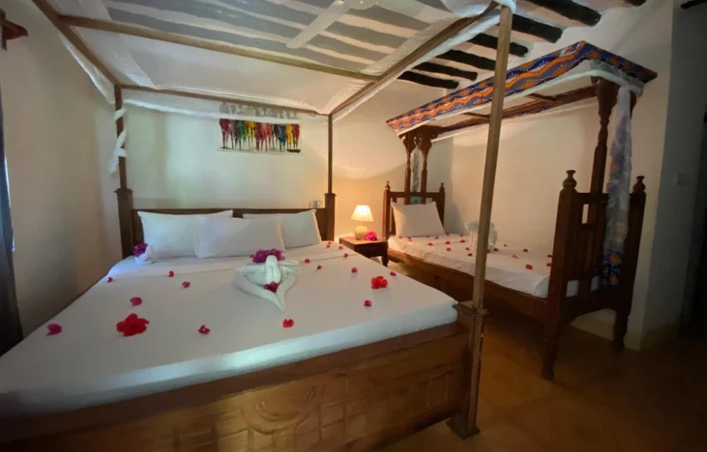 Triple Room with Side Ocean View at Menai Bay Beach Bungalows